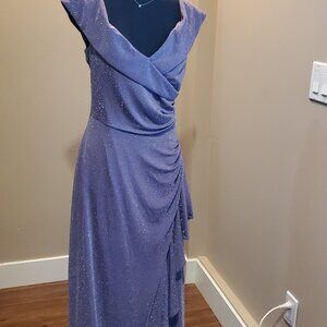 Purple shimmery evening gown with ruffles on the righthand side